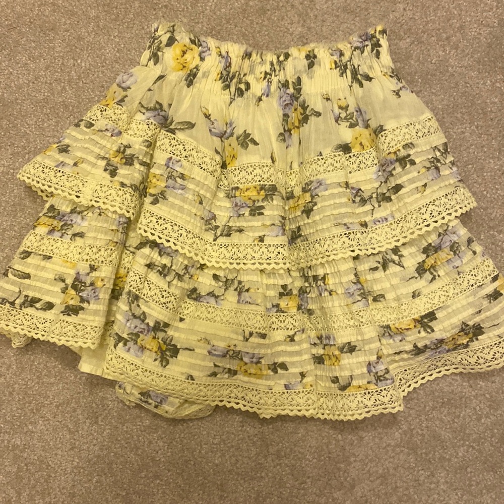 A yellow with floral skirt